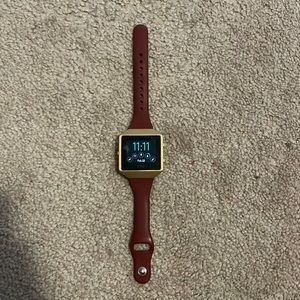 Fitbit with rose gold and maroon band! ⌚️